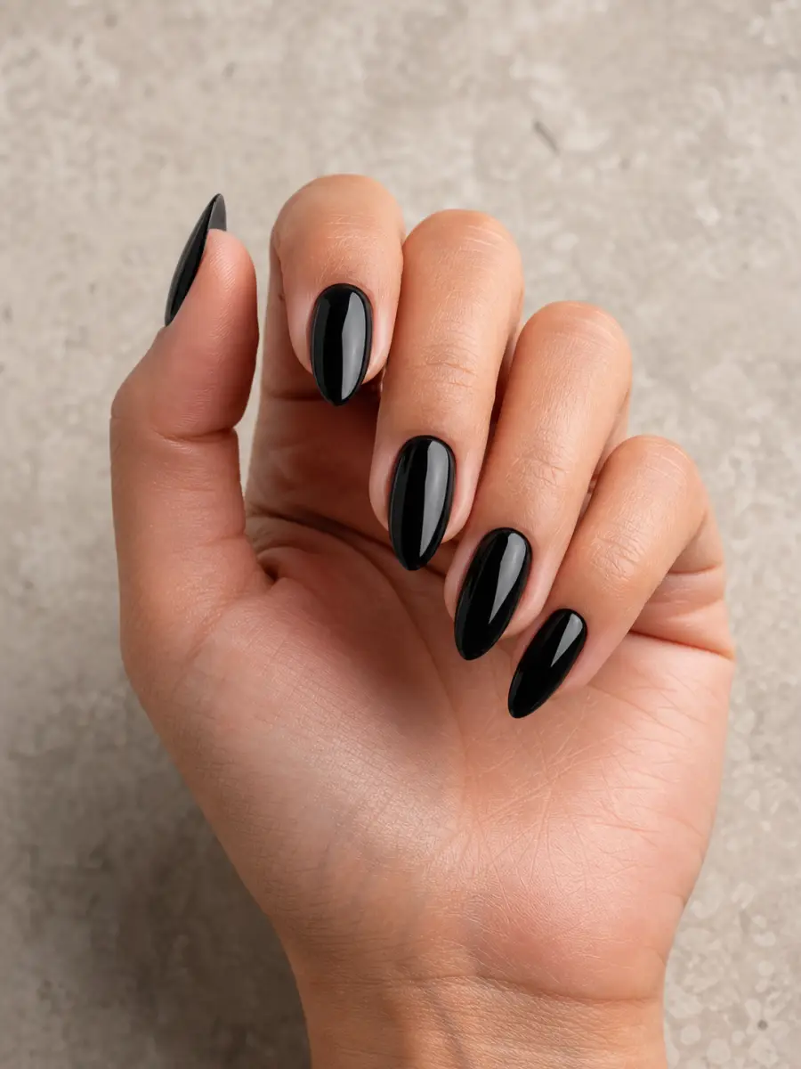 Glossy Black Almond Nails: medium almond, jet black glass finish
