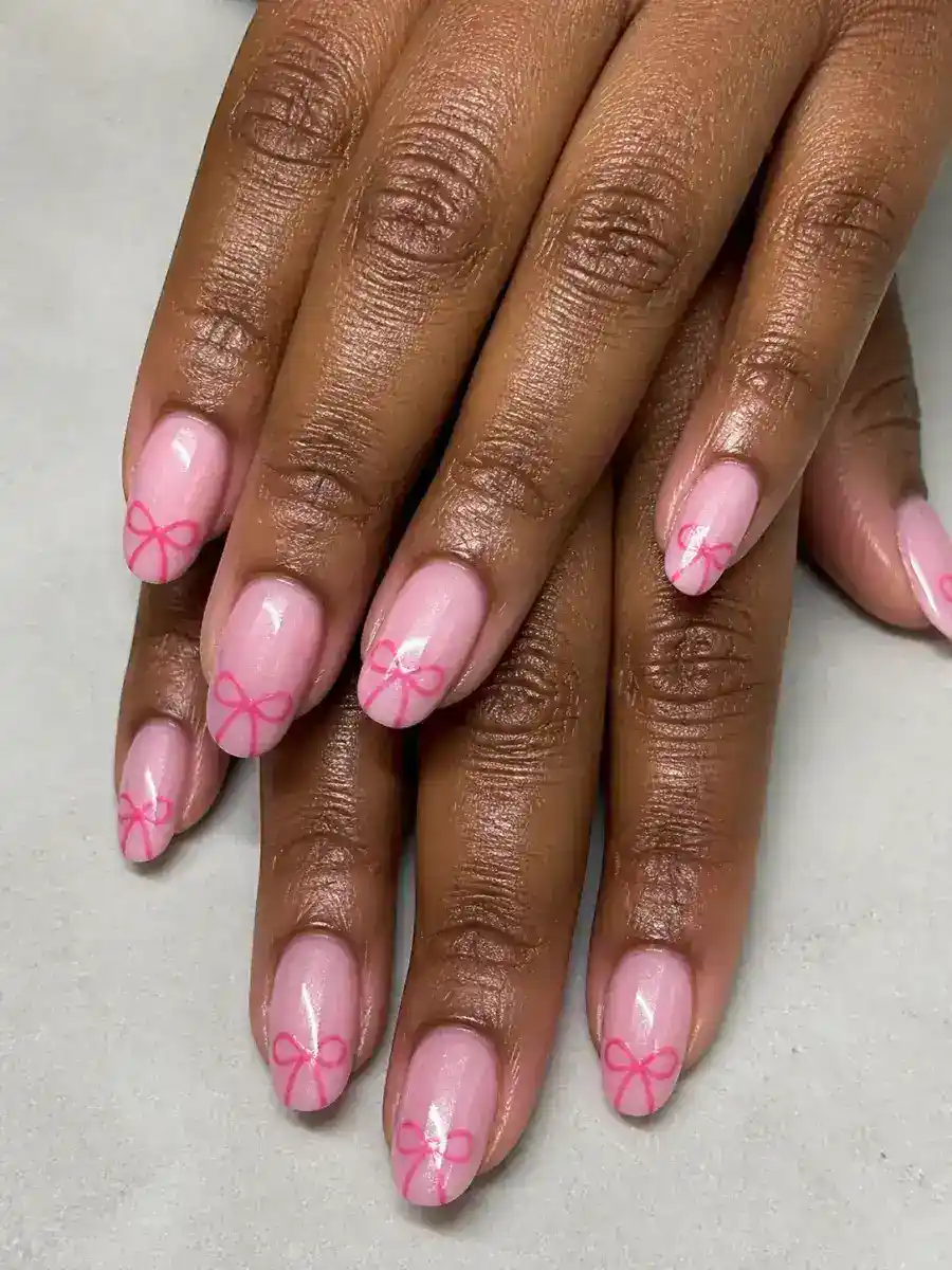 Coquette Bow Nails: pink base, painted bow accent, coquette bow
