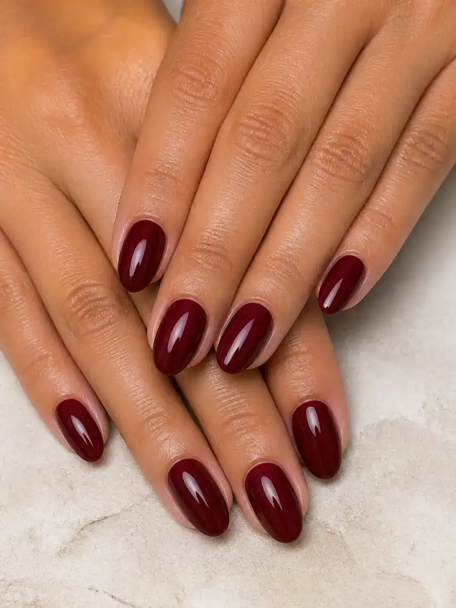 Deep Red Short Nails: almond, muted shade, glossy finish, deep red short