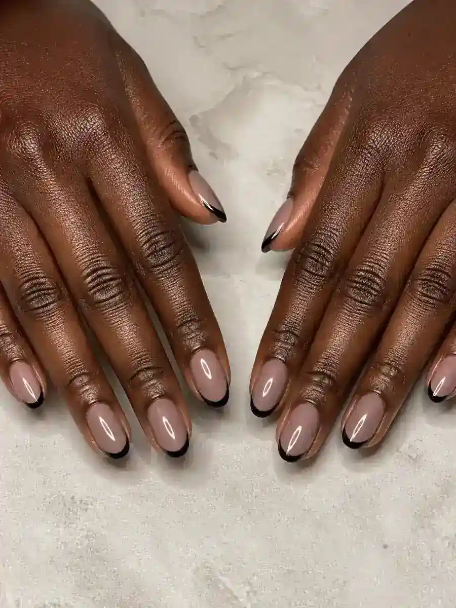 Black Micro Tip Nails: short almond, muted shade, glossy finish, black micro tip
